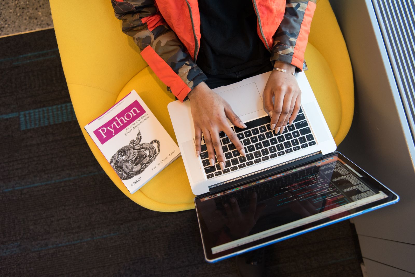Software developer writing and reviewing application code